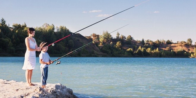 Young boy and women fishing on a lake type 1 diabetes risk factor