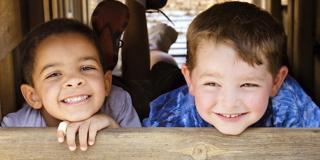 African-American child and caucasian child playing together on playground diabetes in children