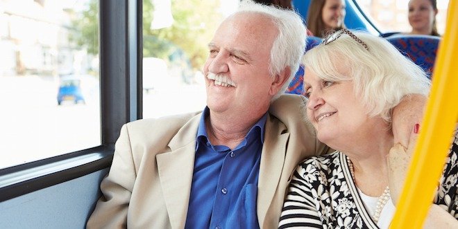 Senior couple looking out of the bus window senior transportation