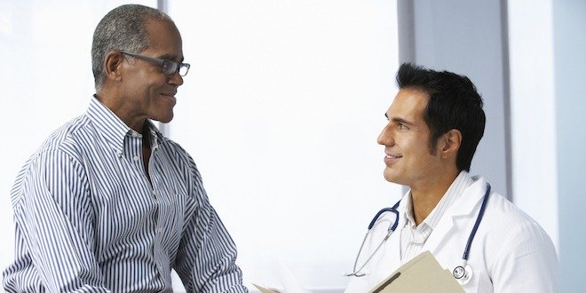 Doctor In Surgery With Male Patient Reading Notes reverse diabetes - visit healthcare team
