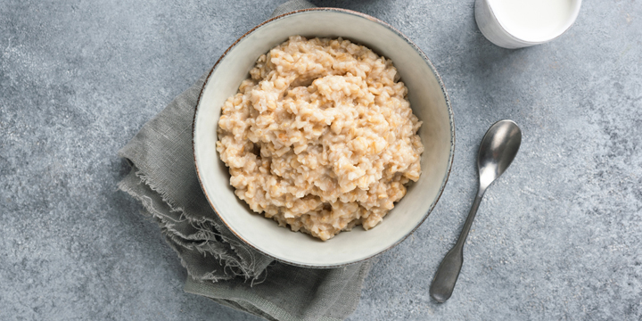 Healthy breakfast porridge oats or oatmeal in bowl
