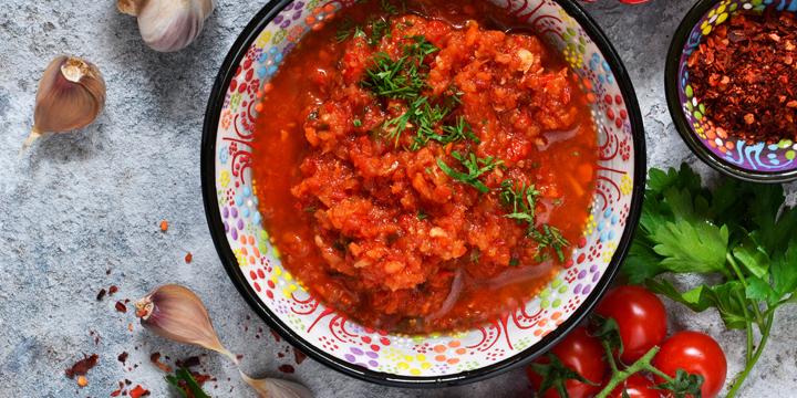Spicy chili sauce with spices, herbs. Tomato sauce with cilantro.