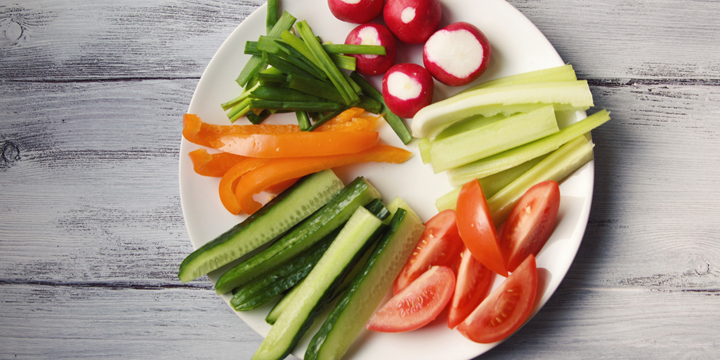 White plate with vegetables for a vegetarian salad veggie snacks