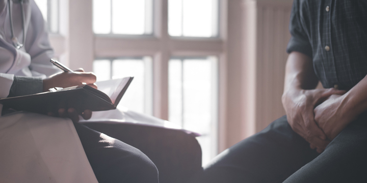 Male doctors and patients, sexual problems are discussing the symptoms and treatment methods.