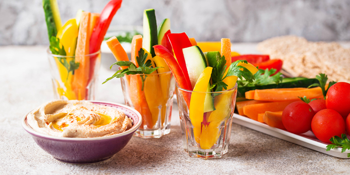 Snacks bar. Vegetables sticks and hummus