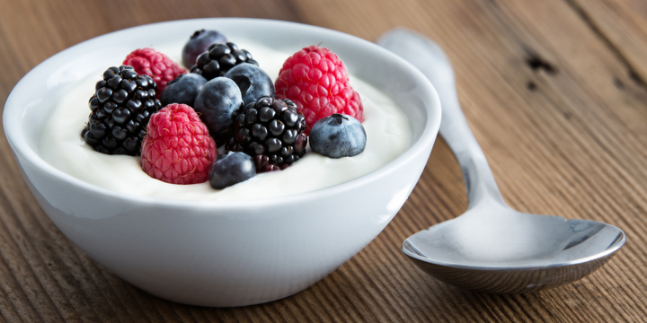 Bowl of fresh mixed berries and yogurt best bedtime snacks