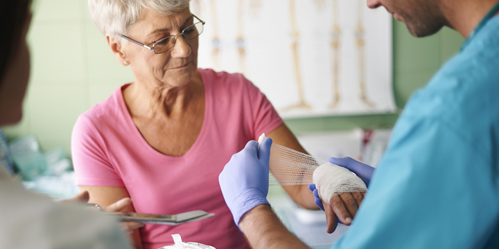 Senior woman with bandage on the hand