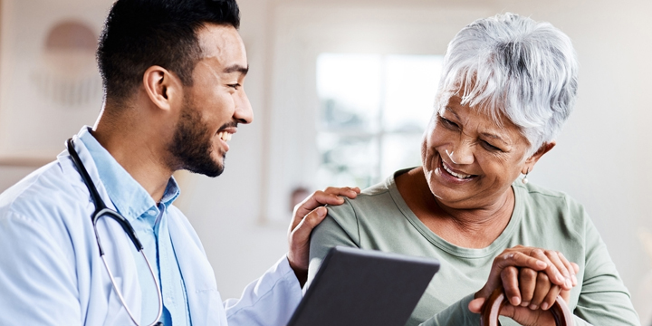 Shot of a young doctor sharing information from his digital tablet with an older patient